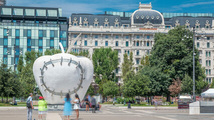 Wall Mural - The monumental sculpture The Reintegrated Apple in front of Milan's central railway station timelapse.