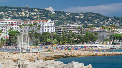 Wall Mural - Colorful old town and beach in Cannes timelapse on french Riviera in a beautiful summer day, France