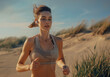 A fit woman in her late thirties jogging on the beach wearing earphones and sportswear