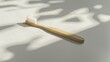 AI-generated illustration of a toothbrush on a white table in the sunlight