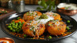 A plate of aloo tikki with fried potato patties, topped with yogurt, tamarind chutney, sev, and spices, and served with green peas.