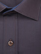 Close-up of a button placket on a plain dark brown shirt