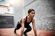 © peopleimages.com - Indian woman, fitness and start position outdoor for race, stretching and exercise in city. Female runner, wellness and training in urban area for athlete, competition and cardio for sports or health