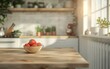 A bowl of tomatoes sits on a wooden table in a kitchen