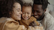 © Sergio - Close up of a happy multiethnic family with a child laughing together at home