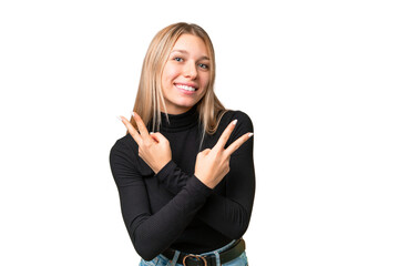 Wall Mural - Young pretty blonde woman over isolated chroma key background smiling and showing victory sign