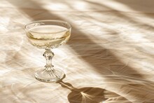 Close-up Of Assorted Wine Glasses, Champagne Coupes, Tumblers And Glasses On A Tray In Sunlight. Beautiful Simple AI Generated Image In 4K, Unique.