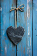 heart shaped slate board with space for text on a rustic wooden wall