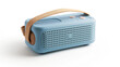 Portable blue Bluetooth speaker with a tan strap on a white background.