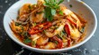 Stir Fried Squid with Curry Powder in white plate ,(pla muk pad pong karee),Thai Food.Top view