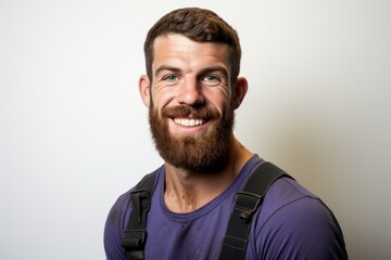 b'Portrait of a smiling young male carpenter wearing work clothes'