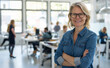 © Peopleimages - AI - Confident, smile and portrait of woman in office with positive, good and pride attitude. Happy, crossed arms and professional graphic designer with creative career in startup workplace in New York.