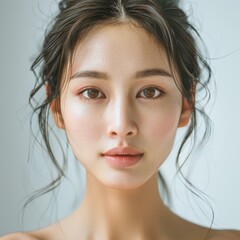 Wall Mural - Portrait of a young Asian woman with brown hair and eyes