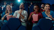 © Drazen - Happy friends having fun while watching comedy movie cinema.