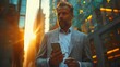 City businessman in gray suit using smartphone near glass windows