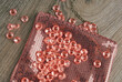 close up of the diamonds with female bag in coral and  peach color