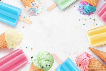 Poster - Variety of colorful pastel ice cream cones and popsicle summer frozen desserts. Top down view frame on a white marble background. Copy space.