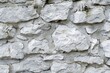 Detailed close up of a wall made of rocks, suitable for background use