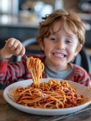 Wall Mural - A young boy is eating spaghetti with a smile on his face