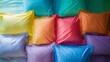 colorful flat lay of rainbow bed sheets and pillowcases neatly arranged