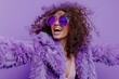 © Fotograf - Stylish woman in purple coat and sunglasses, perfect for fashion blogs or winter themed designs