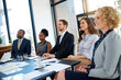 © peopleimages.com - Listen, presentation or business people in audience in seminar, workshop or meeting for coaching. Investors, smile or happy staff in crowd at conference or convention for education, pitch or learning