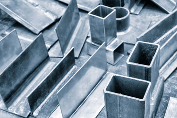 Poster - A bunch of metal pieces are scattered on a table. Scene is chaotic and disorganized