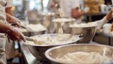 Fototapeta Na sufit - Defocused image 2 The sound of muffled chatter and clanging pots and pans fills the air as busy bakers expertly knead dough and decorate cakes in the background. .