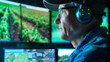 A male farmer wearing glasses and headphones uses advanced technology to analyze crops, an office with screens and monitors.