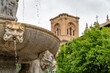 View of the Fuente de los Gigantones in the Bib-Rambla square in Granada (Spain) with the cathedral tower in the background