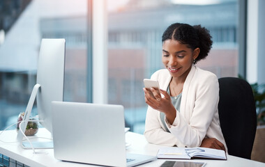 Poster - Business woman, office and phone text with a content creation administrator with social media break. Desk, creative agency and African professional with internet, app and smile from online message