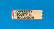 DEI diversity equity and inclusion symbol. Concept words DEI diversity equity and inclusion on stick. Beautiful blue background. Business DEI diversity equity and inclusion concept. Copy space.