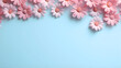 Border with pink flowers and copy space. Summer flowers on blue background. Template for presentation, slide, print.	