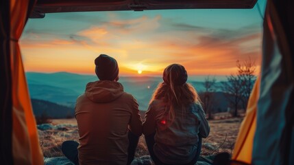 Sticker - A couple is sitting in a tent and looking at the sunset