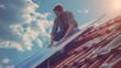 a handsome man installs the solar panel on the roof of a family house. high quality