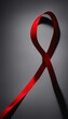 Red ribbon curved into a support symbol against a grey background, high-quality image for social campaigns
