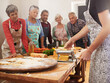 © peopleimages.com - Cooking course, pasta and chef with senior people in kitchen for help, guide or how to questions, advice or steps. Learning, class and nutritionist with audience for teaching, ravioli or nutrition