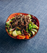 Salad with beef meat and vegetables in a plate . Asian cuisine. Delicious and healthy food. Photo for the menu.