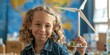 Happy smart children looking at camera while holding wind mill model with blurring background. Smiling kid smiling to camera while learning about green energy environmental power. ESG concept. AIG42.