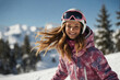A beautiful girl is snowboarding at a ski resort.Smiling.Portrait.
