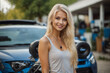 A beautiful blonde girl at an auto sound competition. Car music. Subwoofers, amplifiers, acoustics. Car audio system.
