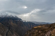 Colca Canyon sunrise with sunbeam and snow, Arequipa, Peru.