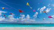 Colorful kites flying in a clear sky above a turquoise sea with white sandy beach.