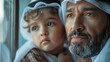 © Fatima - Arabian father embracing son at home looking at the window