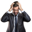 © OKAN - Frustrated businessman on transparent background holding his head in despair