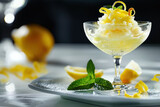 Fototapeta  - refreshing lemon sorbet in glass garnished with mint and lemon zest