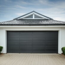 A Black Garage Door With A Black Roof