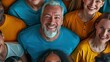 people of varying ages, races, and genders, all wearing a blue-green or yellow t-shirt, all smiling