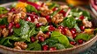 Close-up of a colorful salad with spinach, walnuts, and pomegranate seeds