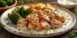 chicken cooked in a creamy yogurt sauce accompanied by broccoli and potatoes